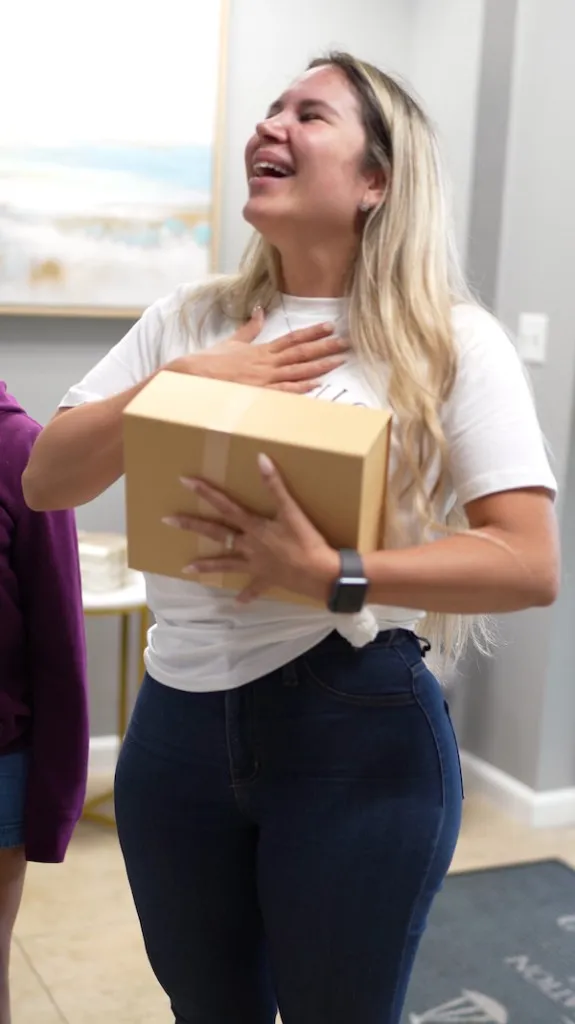 Client reacting with joy after an approved immigration case