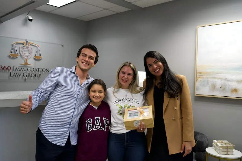 Happy family celebrating an approved case at the 360 Immigration Law Group office